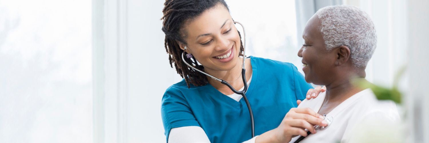 Healthcare Professional Listening to a Patient's Heart